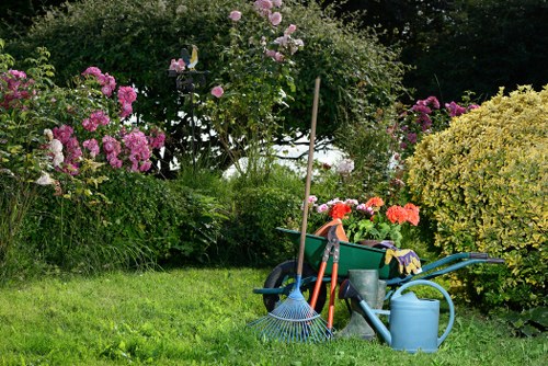 Garden worker using protective equipment during maintenance