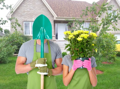 Professional gardener reviewing a booking and site details before work begins